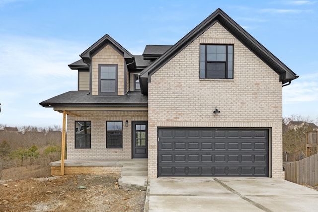 view of front of house with covered porch, concrete driveway, brick siding, and an attached garage