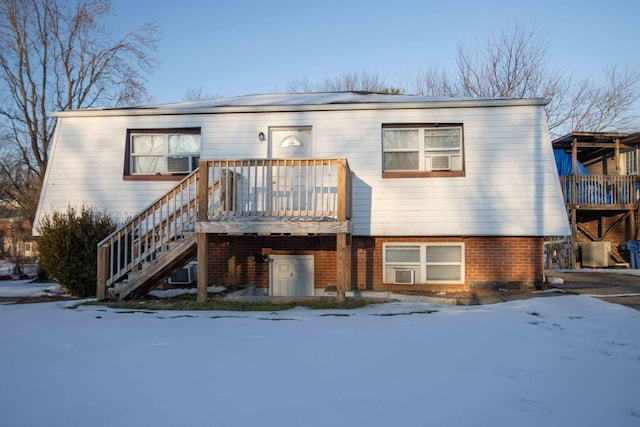 view of front facade featuring a deck and cooling unit