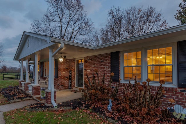 view of side of property with a porch