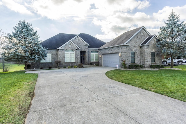 view of front of home featuring a garage and a front yard