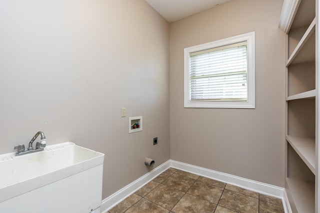 washroom featuring sink, hookup for an electric dryer, hookup for a washing machine, and dark tile patterned floors