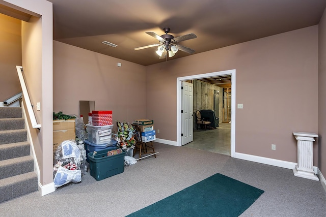 miscellaneous room with ceiling fan and carpet flooring