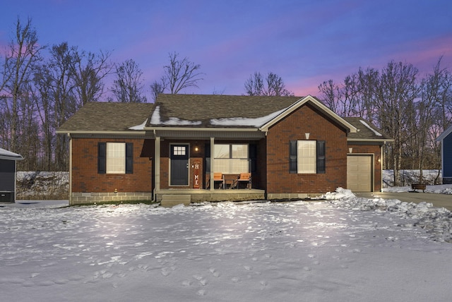 view of front facade featuring a garage and covered porch