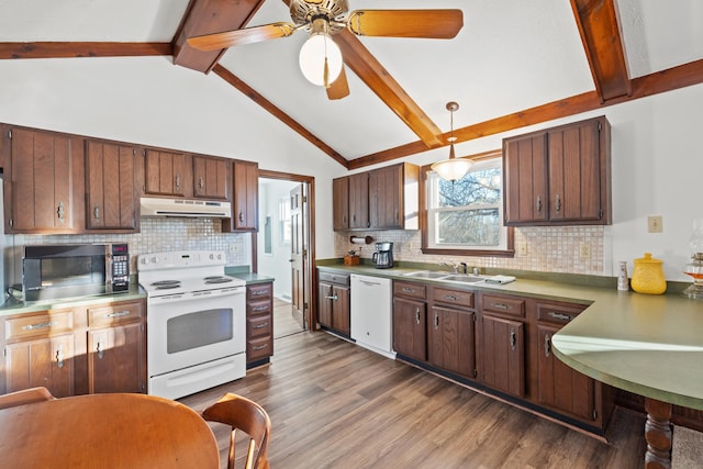 kitchen featuring beamed ceiling, pendant lighting, backsplash, and white appliances