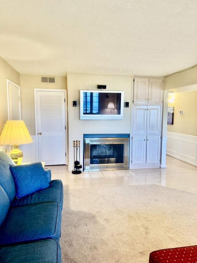 living room with a textured ceiling