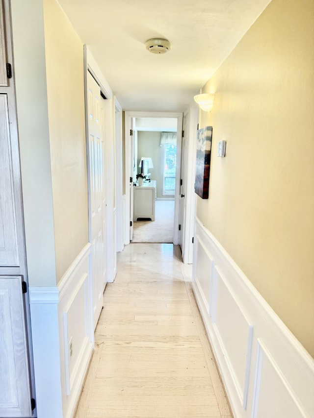 hallway featuring light hardwood / wood-style flooring