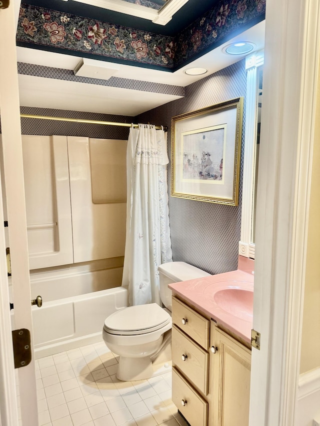 full bathroom featuring toilet, tile patterned flooring, vanity, and shower / tub combo with curtain