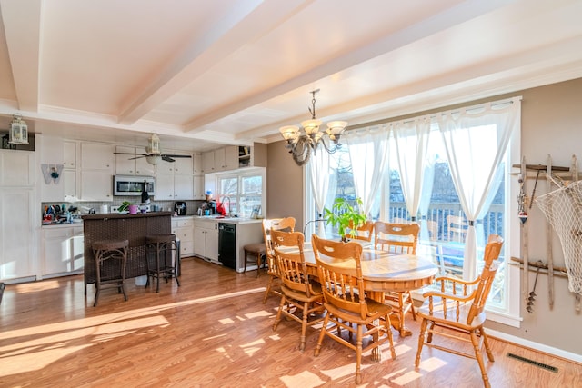 dining space featuring beam ceiling, sink, light hardwood / wood-style flooring, and a notable chandelier