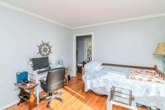 bedroom featuring hardwood / wood-style floors and ornamental molding