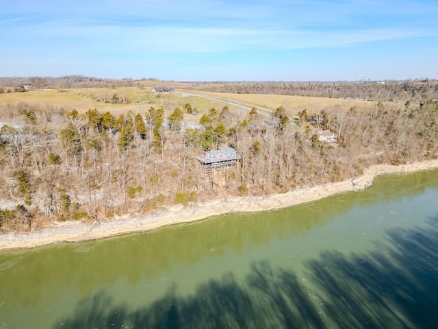 birds eye view of property with a water view and a rural view