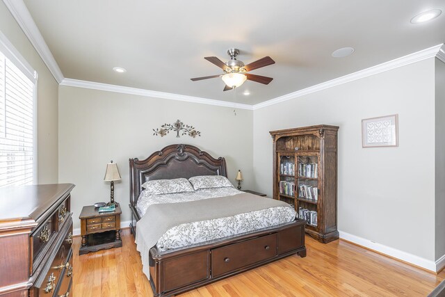 bedroom with crown molding, ceiling fan, and light wood-type flooring