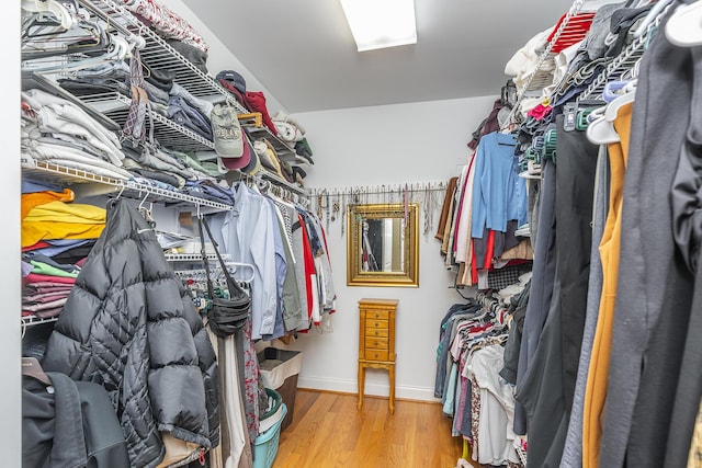 spacious closet featuring light hardwood / wood-style floors