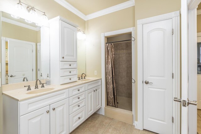 bathroom with crown molding, tile patterned floors, a shower with shower curtain, and vanity