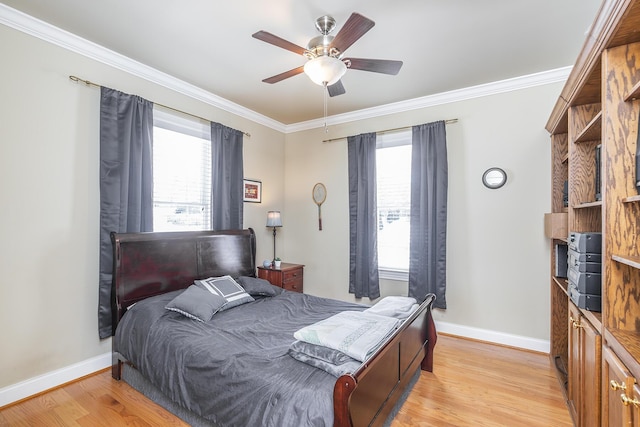 bedroom featuring multiple windows, light hardwood / wood-style flooring, and ornamental molding