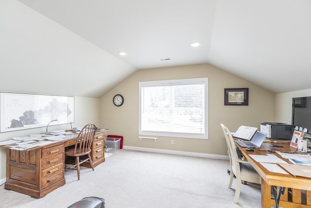 carpeted home office with lofted ceiling