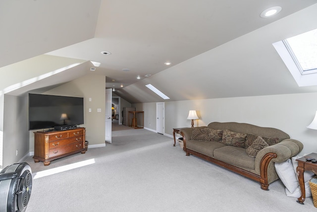 living room with vaulted ceiling with skylight and light colored carpet