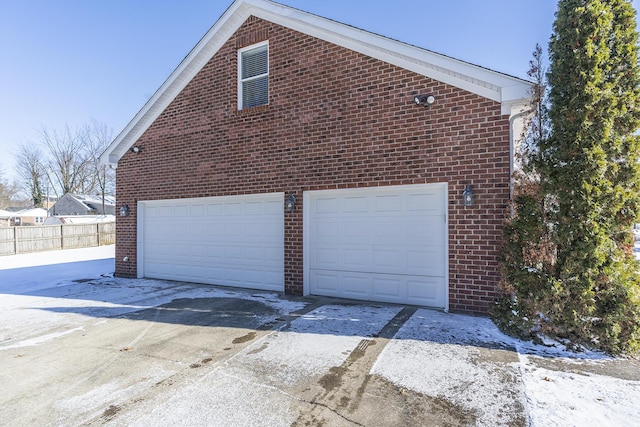 view of side of home featuring a garage