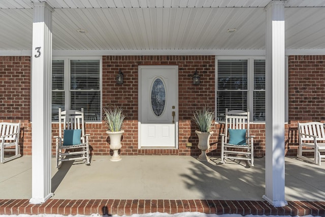 doorway to property with covered porch