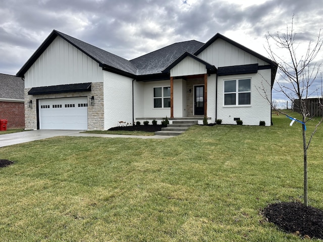 view of front of property with a front lawn and a garage