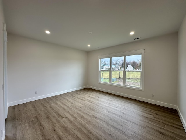 unfurnished room featuring light wood-type flooring