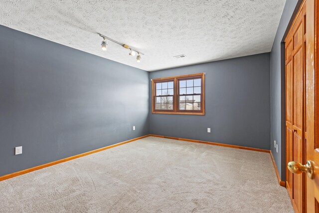 empty room featuring light colored carpet