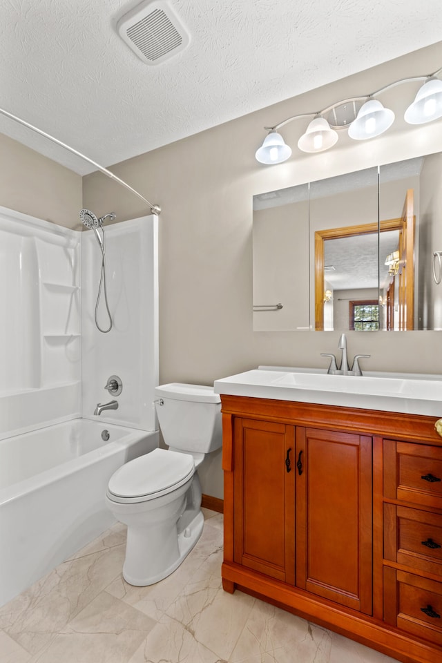 bathroom with a textured ceiling, toilet, vanity, visible vents, and marble finish floor