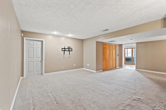 interior space with carpet, visible vents, and baseboards