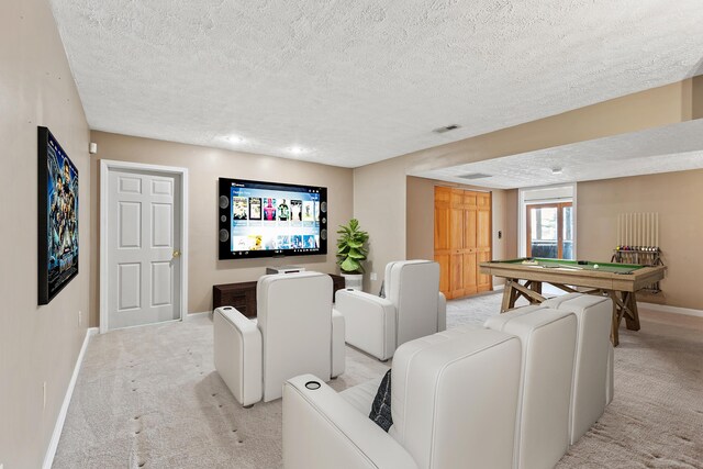 empty room with a textured ceiling and light wood-type flooring