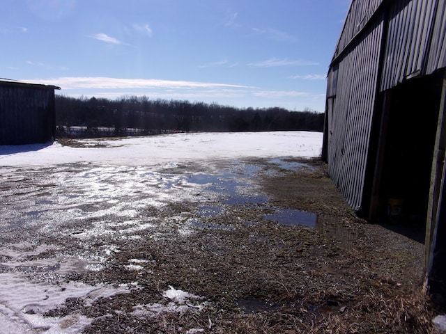 view of yard layered in snow