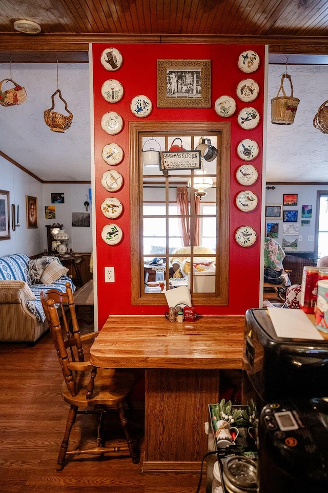 dining space with ornamental molding, hardwood / wood-style flooring, wooden ceiling, and a healthy amount of sunlight