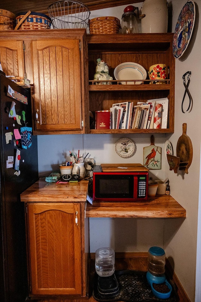 interior space with black fridge