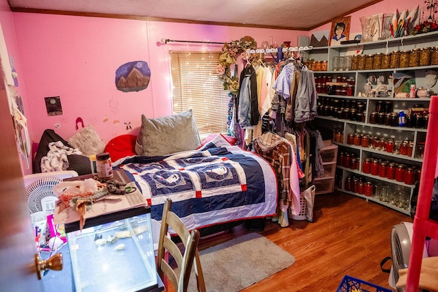 bedroom with hardwood / wood-style flooring