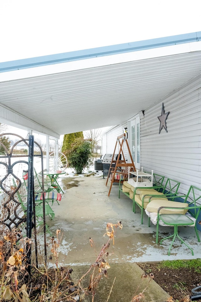 view of patio featuring a grill