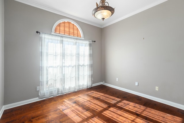 unfurnished room with wood-type flooring and ornamental molding