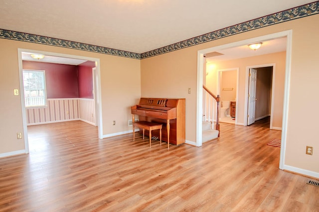 unfurnished room with light hardwood / wood-style flooring