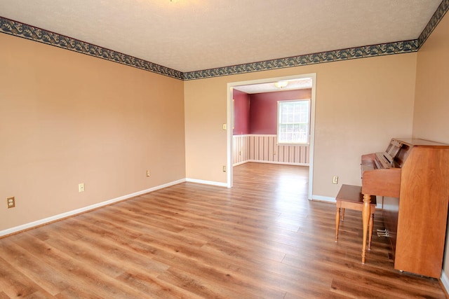 empty room with wood-type flooring