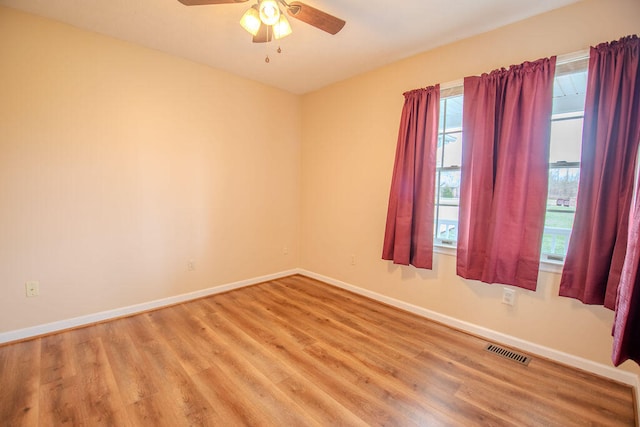 unfurnished room featuring hardwood / wood-style flooring and ceiling fan