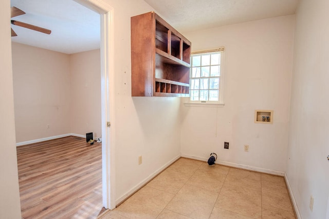 laundry room with hookup for a washing machine, ceiling fan, and light tile patterned flooring