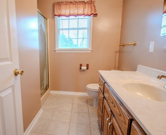 bathroom with tile patterned flooring, vanity, toilet, and walk in shower