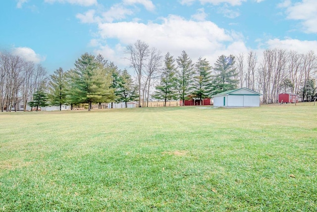 view of yard with an outbuilding and a garage