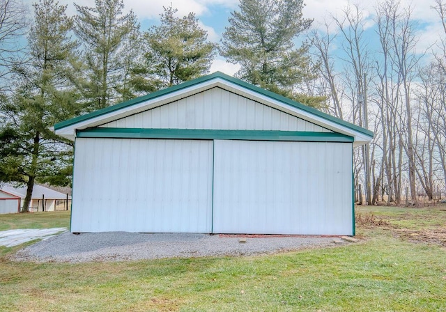 garage featuring a lawn