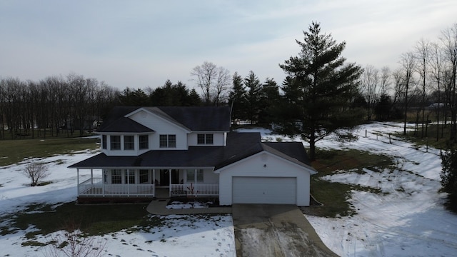 view of front facade featuring a garage and covered porch