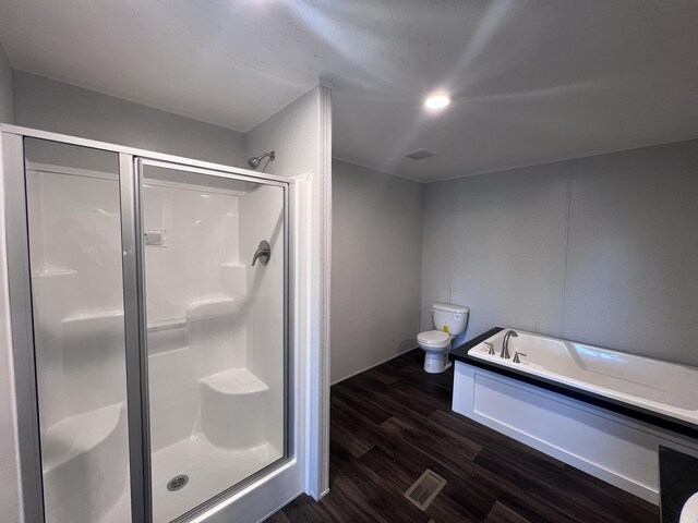 unfurnished bedroom with ornamental molding, visible vents, dark wood finished floors, and a textured ceiling