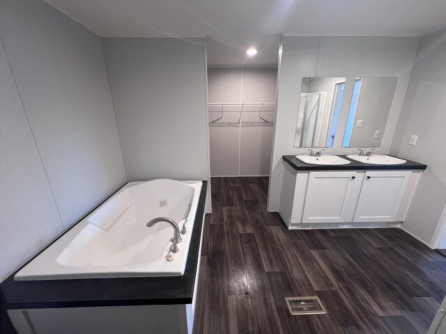 unfurnished room featuring ceiling fan, a textured ceiling, dark wood finished floors, and crown molding