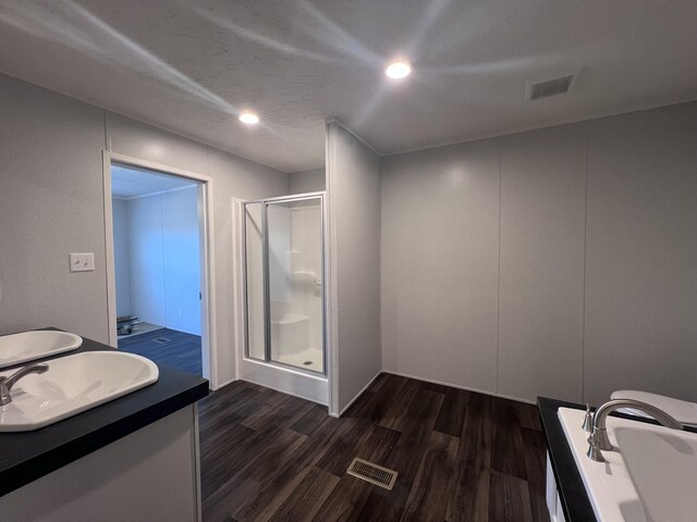 spare room featuring a textured ceiling, ornamental molding, and dark wood-style flooring