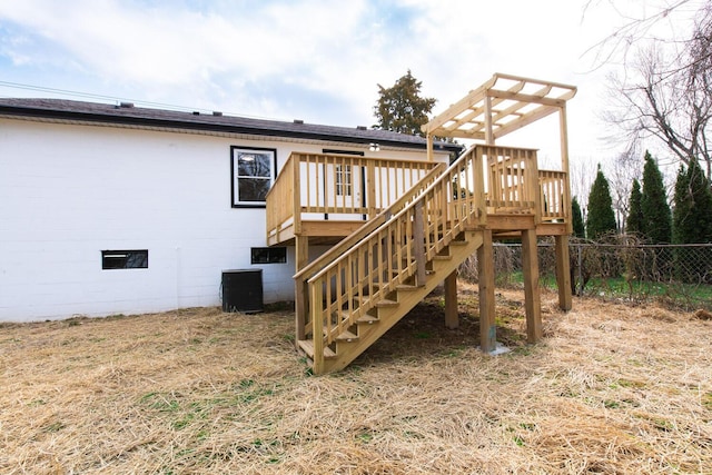 back of house featuring central AC unit, stairs, a deck, and fence