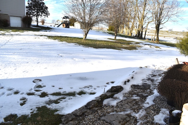 view of yard layered in snow