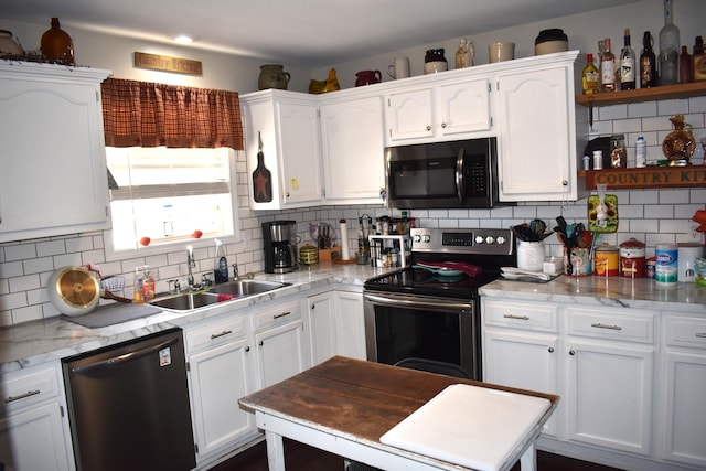 kitchen featuring appliances with stainless steel finishes, decorative backsplash, and sink