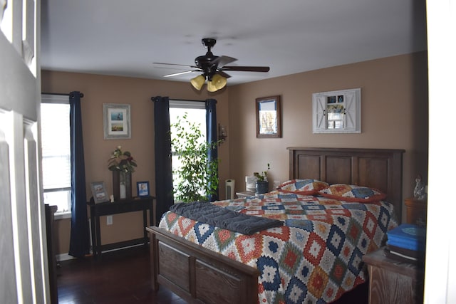 bedroom featuring ceiling fan and dark hardwood / wood-style flooring