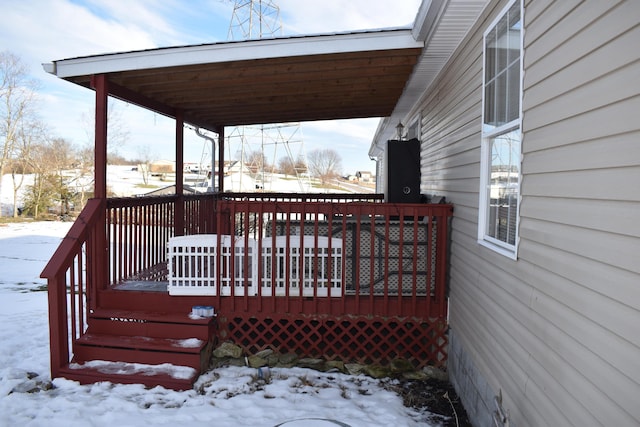 view of snow covered deck